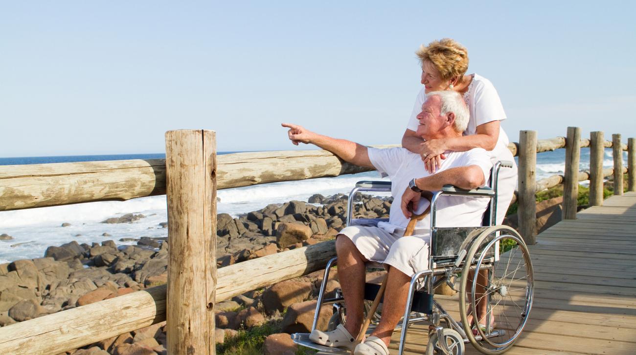 elderly couple by beach