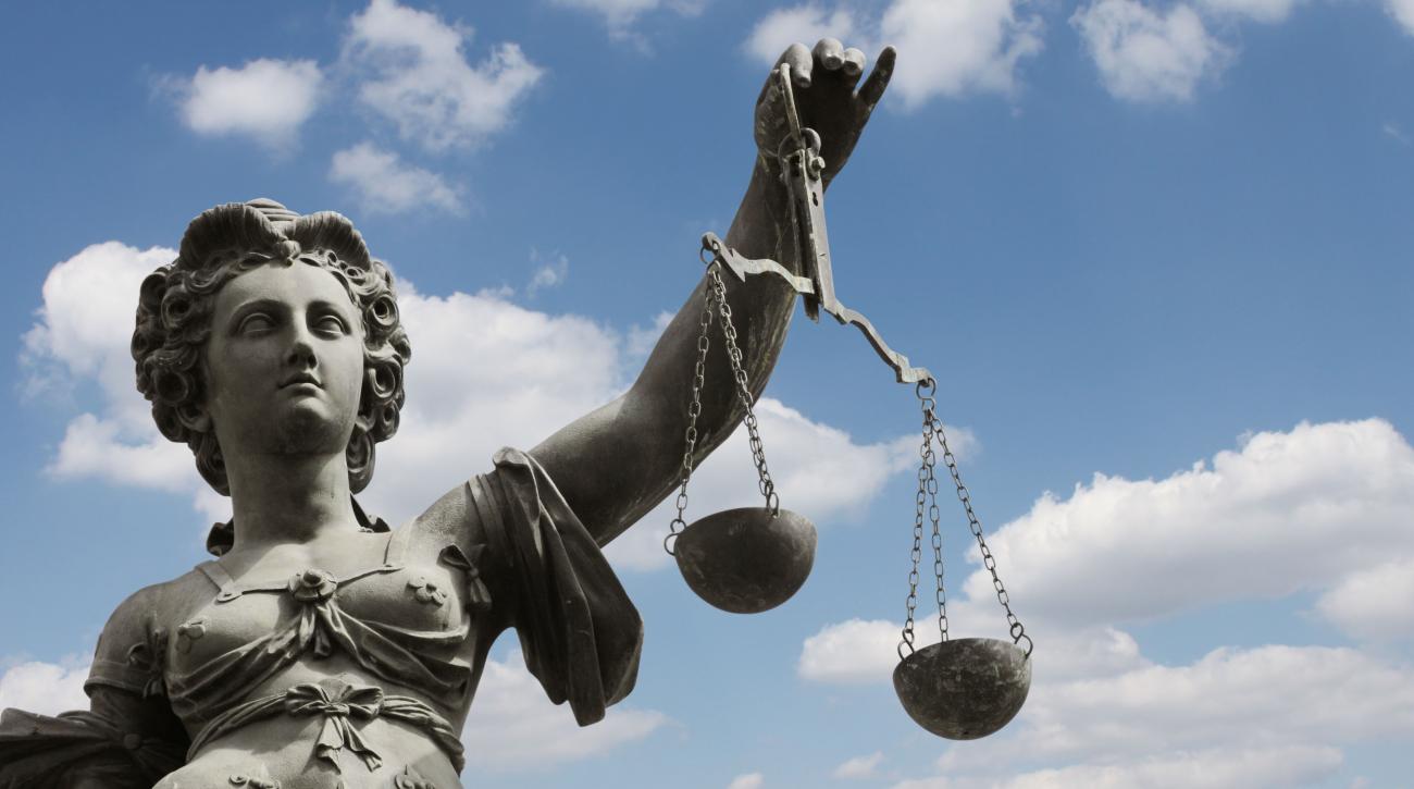 Statue of Justice holding scales