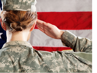 Woman saluting in front of flag