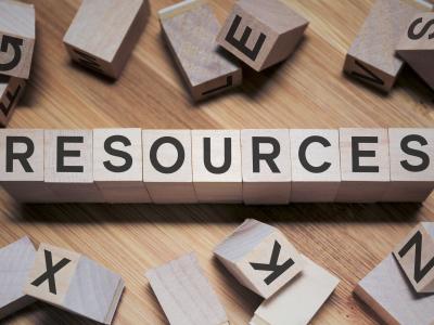 Wooden blocks spell out the word "resources."
