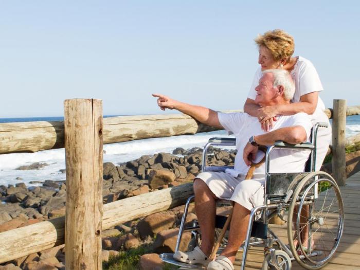 elderly couple by beach